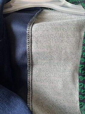 2 shades  Navy and Green Blazer Jacket with writing on one side.Too small for me